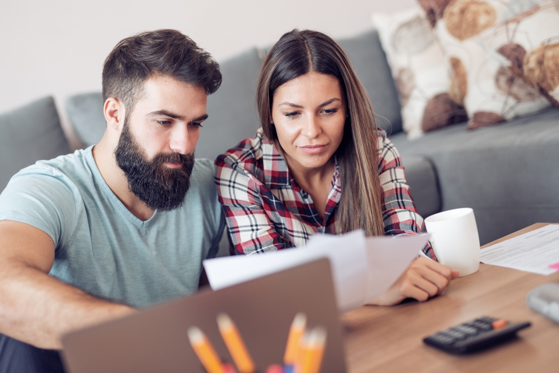 Young couple working on estate planning documents together