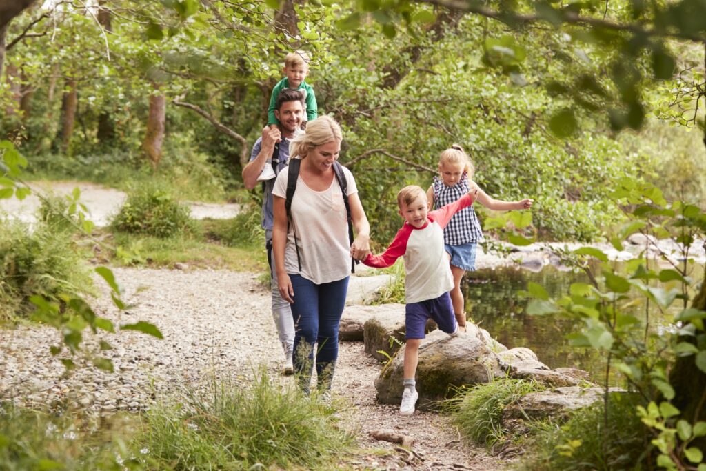 Family with basic life insurance on hiking path